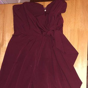 strapless burgundy jumpsuit with bow detail. M